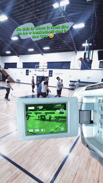 A pick-up basketball game in a closed gym setting, with an old-school '90s camcorder filter in the foreground.