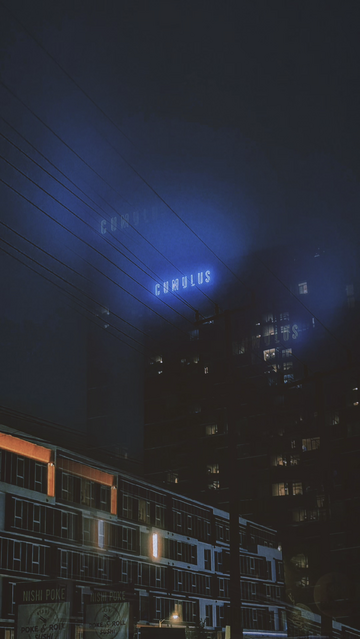 Photo of the mixed-use 'Cumulus' building and its light blue neon sign on a slightly foggy night in L.A.